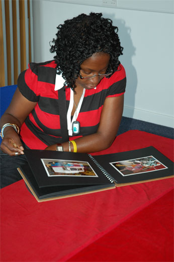 woman looking at photographs in an album